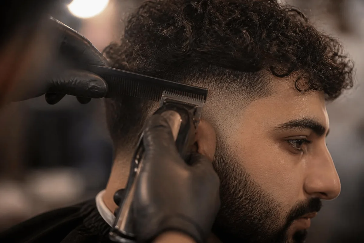 Blend curls into low taper fade